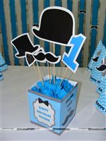 Box type Little Man center pieces with bow tie, Mush, No 1 and hat toppers. Baby name personalised on the box.