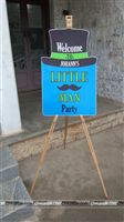 Welcome to Johanns Little Man Party - Entrance board setup on a wooden easel
