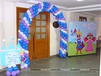 A royal entrance to a Prince theme birthday party with a castle cutout with a welcome message and a photo booth for all the little princes and princesses. 