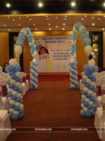 Royal walkway to a Little Prince theme birthday party stage with an archway using floating helium balloons on either side
