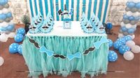 Cake table with a Blue Tutu table cover, Personalised hats and No 1 Little Man piece
